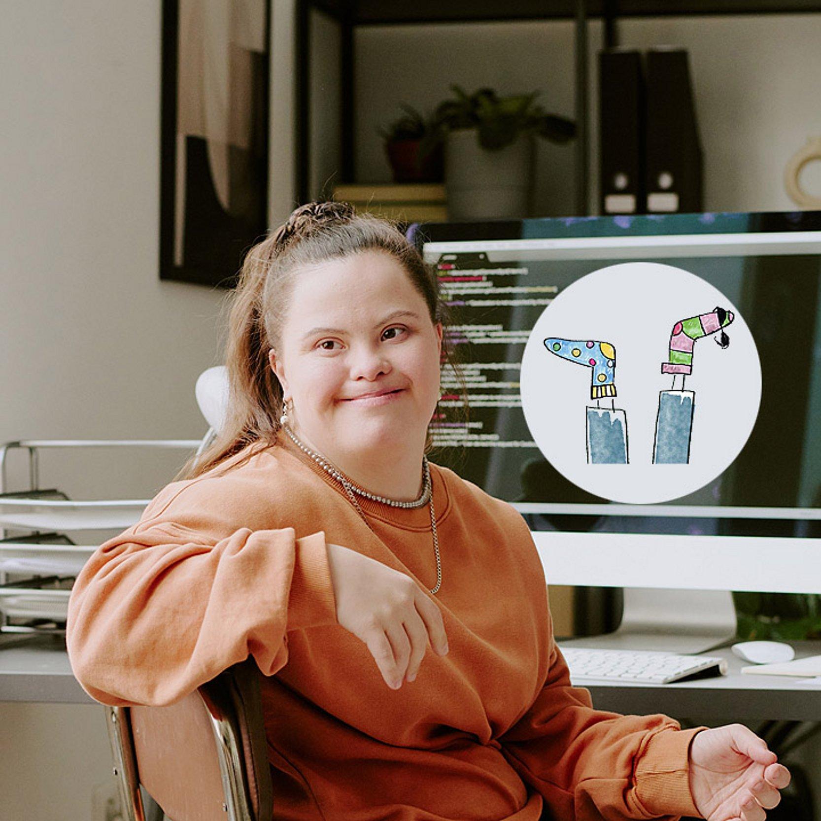 Inklusion im Job Eine junge Frau mit Trisomie 21 sitzt am Computer