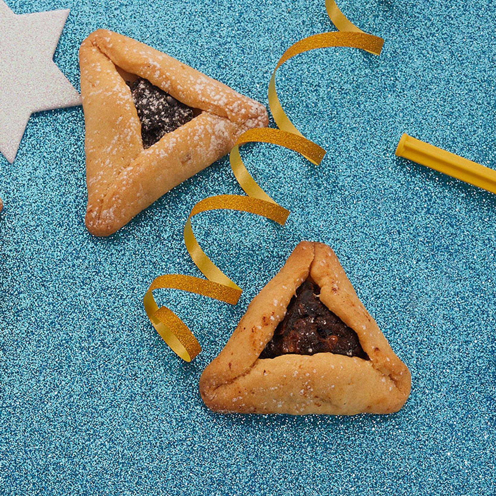 Purim Gebäckteile und Luftschlangen