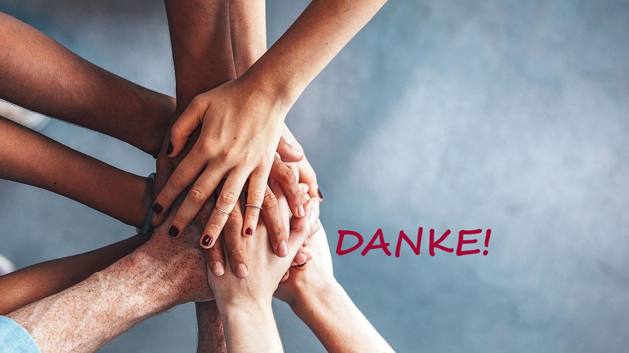 Übereinandergelegte Hände und das Wort "Danke"