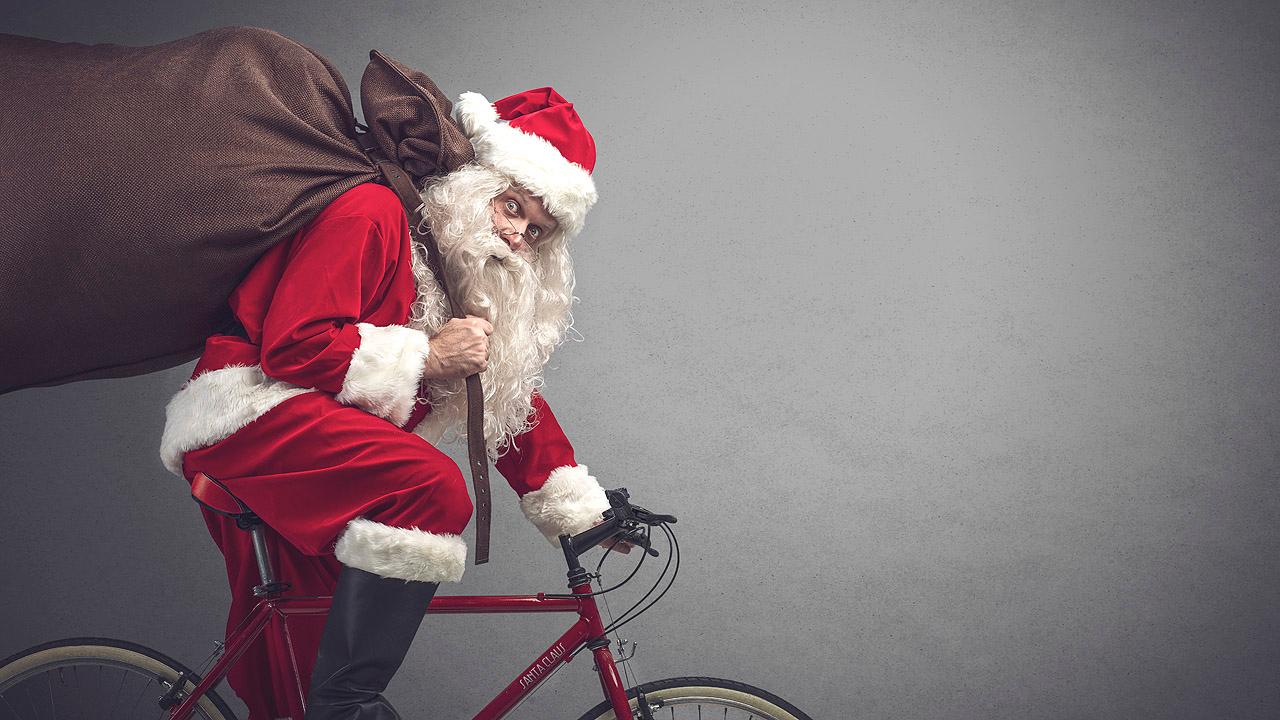 Weihnachtsmann Weihnachtsmann auf Fahrrad